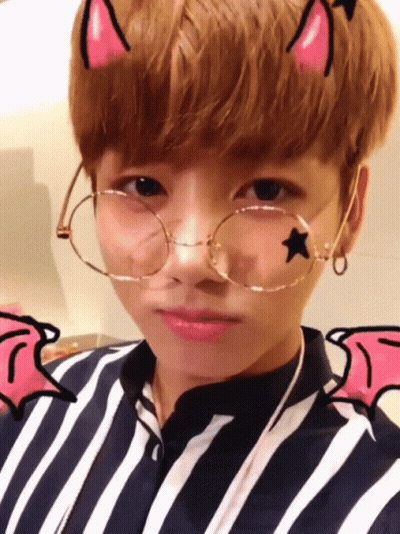 Young Boy With Forehead Star, Glasses, Striped Shirt GIF