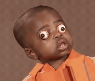 Young Boy With Googly Eyes And Orange Shirt GIF