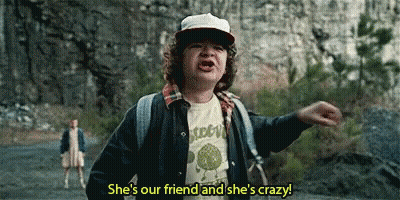 Young Boy With Hat And Backpack Talking To Woman On Road GIF