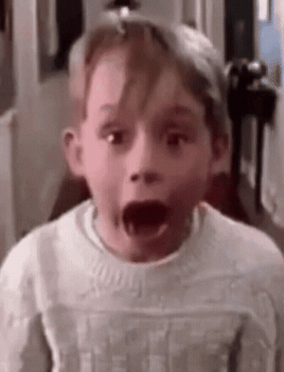 Young Boy With Mouth Open Wearing White Sweater GIF