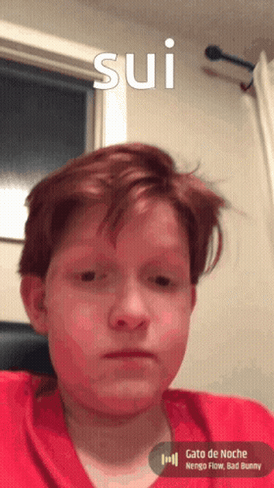 Young Boy With Red Hair Looking At Camera Sui GIF