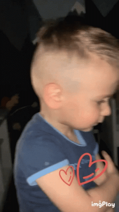 Young Boy With Two Red Hearts GIF