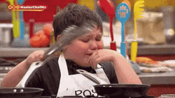 Young Chef Cooking While Crying GIF