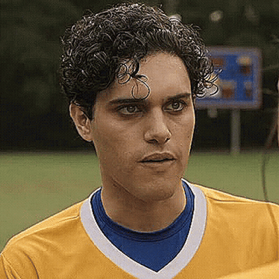 Young Curly Haired Man In Yellow Blue Soccer Jersey GIF