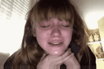 Young Girl Crying With Eyes Closed GIF