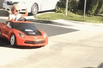 Young Girl Driving Red Toy Car GIF