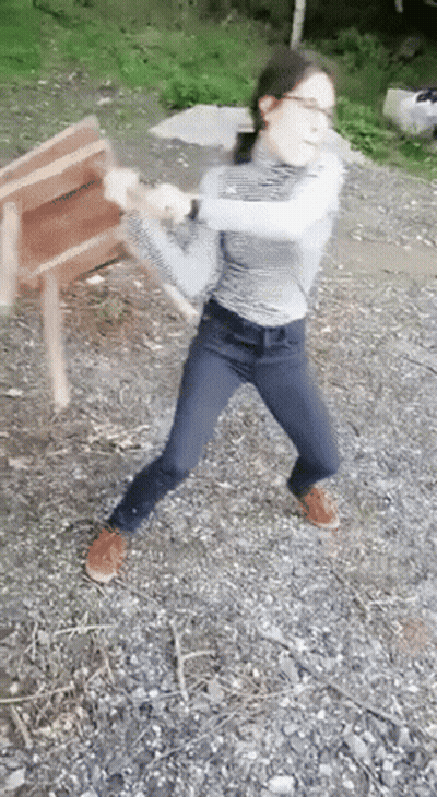 Young Girl Holding Wooden Chair GIF