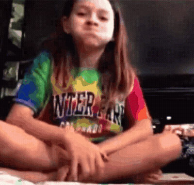 Young Girl In Tie-Dye Shirt Saying Inter Car GIF