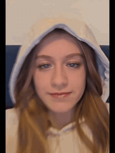 Young Girl In White Hoodie With Hood Up GIF