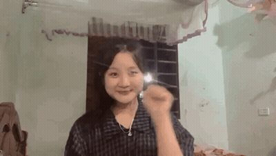 Young Girl Smiling In Front Of Mirror GIF