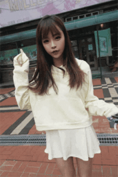 Young Girl Squatting With Legs Crossed Looking Up GIF