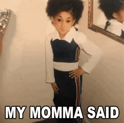 Young Girl Standing In Front Of Mirror GIF