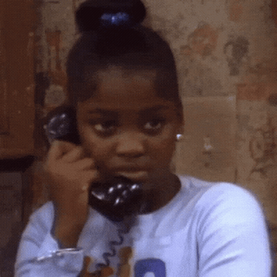 Young Girl Talking On Phone With Blue Ponytail GIF