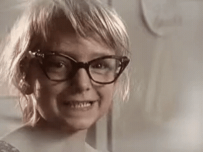 Young Girl Wearing Glasses Smiling GIF