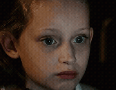 Young Girl With Blue Eyes Looking At Camera GIF