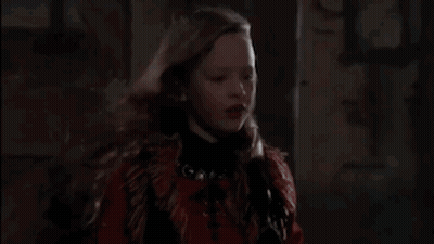 Young Girl With Long Hair In Dark Room GIF