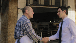 Young Man And Mature Man Hands GIF