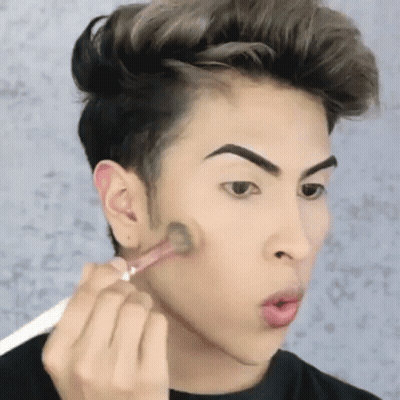 Young Man Applying Makeup GIF