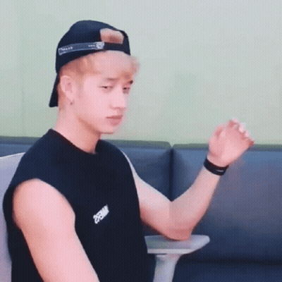 Young Man Baseball Cap Black Tank Top Sitting Chair GIF