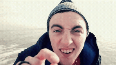 Young Man Beanie Jacket Smiling Pointing At Camera GIF
