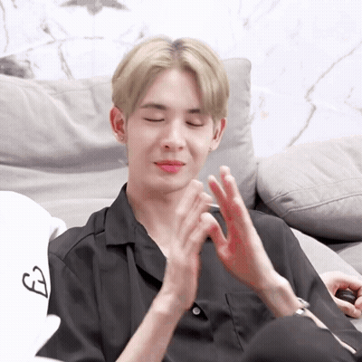 Young Man Clapping With Eyes Closed GIF