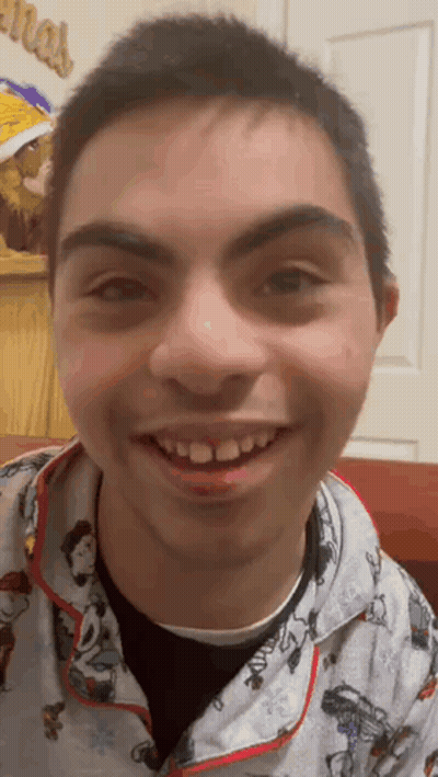 Young Man Close Up Christmas Sign GIF