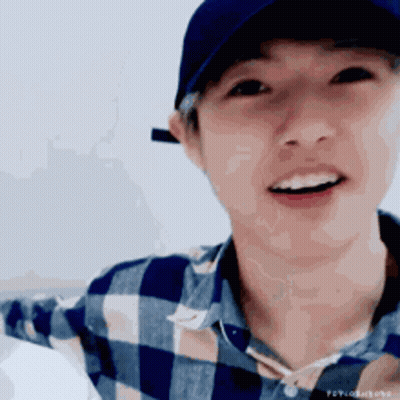 Young Man Close Up In Yellow And Green Shirt GIF
