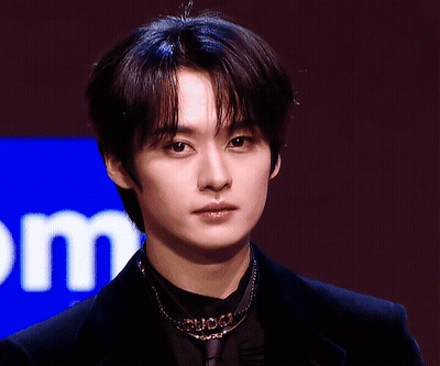 Young Man Close Up With Letter M GIF