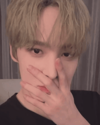 Young Man Covering Face GIF