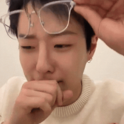 Young Man Covering Mouth With Hand GIF