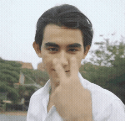 Young Man Covering Nose With Finger GIF