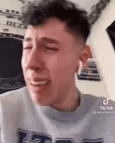 Young Man Crying Eyes Closed Grey Shirt GIF