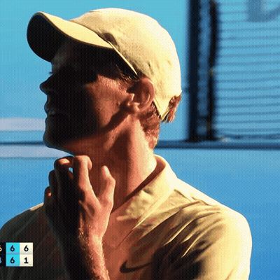 Young Man Curly Hair Looking At Camera Dark Room GIF