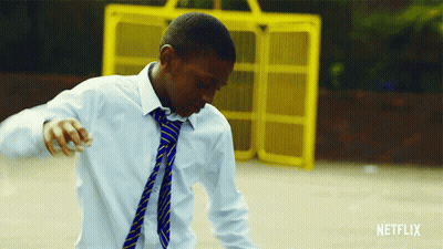 Young Man Dancing In Front Of Netflix Fence GIF