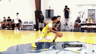 Young Man Dribbling Basketball On Court GIF