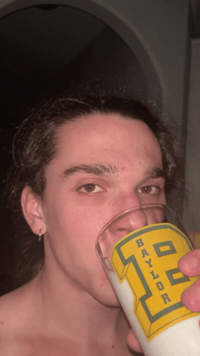 Young Man Drinking From Baylor Glass GIF