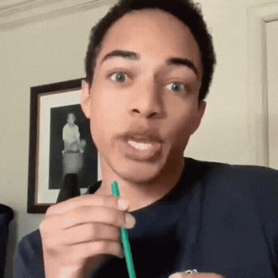 Young Man Drinking Through Green Straw Making Funny Face GIF