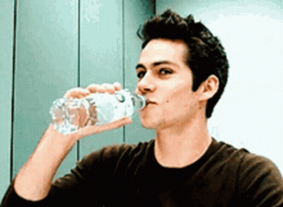 Young Man Drinking Water From Bottle GIF