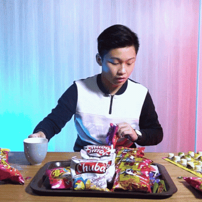 Young Man Eating Bag Of Chuba Potato Chips GIF