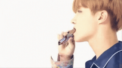 Young Man Eating Snickers Bar GIF