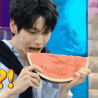 Young Man Eating Watermelon With Exclamation Point GIF