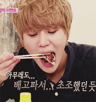 Young Man Eating With Chopsticks Korean Writing GIF