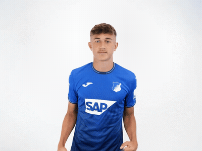 Young Man Flexing Muscles In Blue Shirt Saying Sap GIF