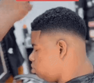 Young Man Getting Haircut At Barber Shop GIF