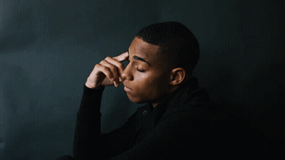 Young Man Hand To Forehead Looking Down GIF