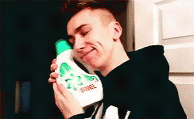 Young Man Holding Ariel Detergent GIF