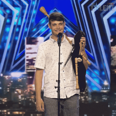 Young Man Holding Bagpipe At Espana Talent Sign GIF