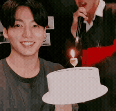 Young Man Holding Birthday Cake With Candle GIF