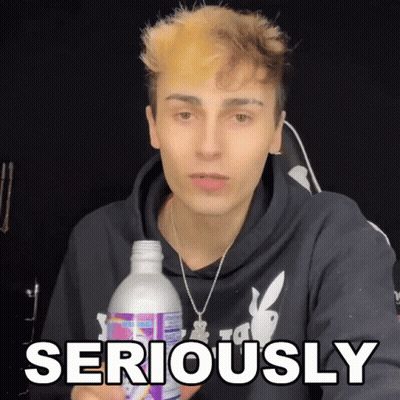 Young Man Holding Bottle Saying Seriously GIF