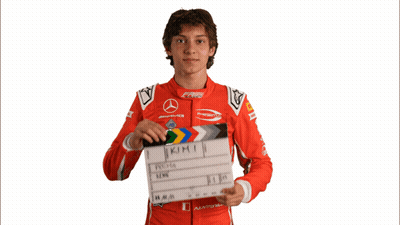 Young Man Holding Clapper Board With Kimi GIF